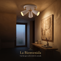 La Bienvenida: COMPAS REDONDO encendido en el recibidor iluminando arte y consola
