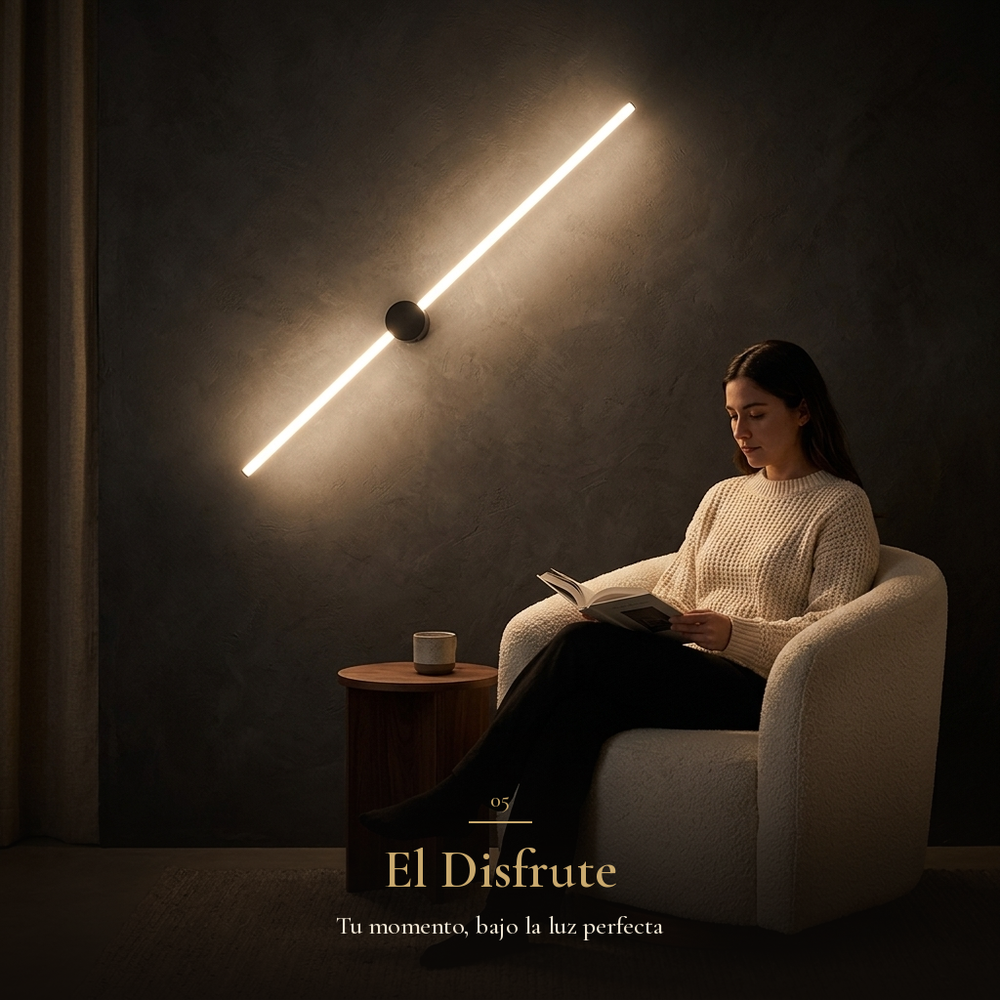 El Disfrute: mujer leyendo en sillón bajo la luz de DIVALA II