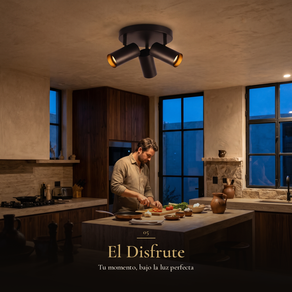 El Disfrute: Hombre cocinando en una cocina iluminada por QUILLA REDONDO